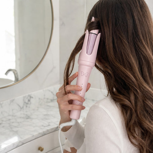 Curling long hair with the Curl Girl automatic curler (illustration)